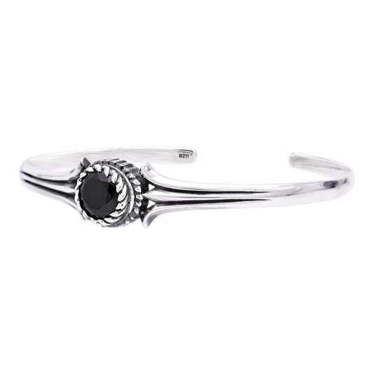Truelements Jewelry unisex sterling silver bangle featuring a central 8mm black cubic zirconia stone and oxidized finish