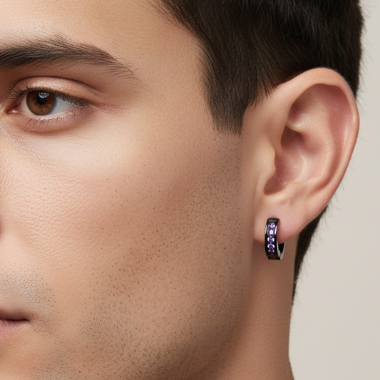 Truelements Jewelry men's black surgical stainless steel hoop earring with a 2mm purple zirconia stone on a model