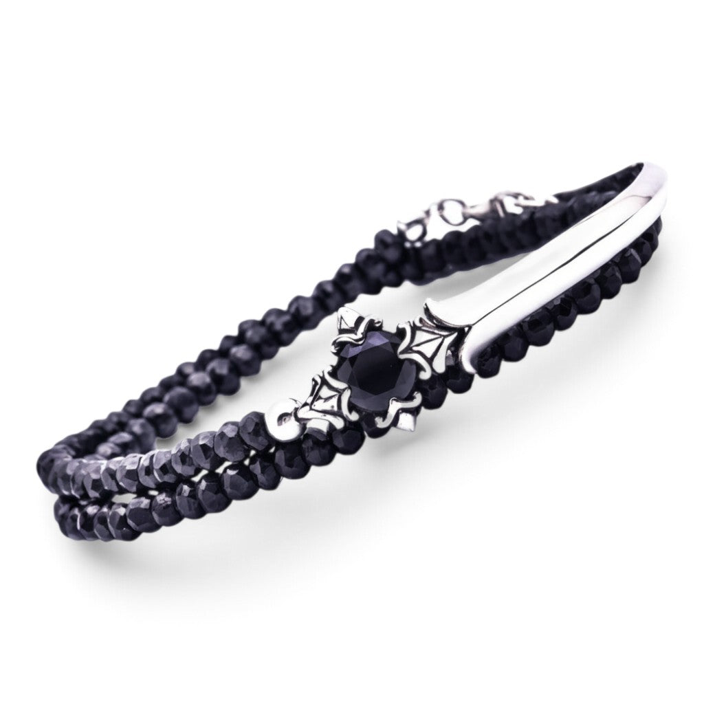 Truelements Jewelry men's bracelet featuring 4mm black spinel beads, a silver 925 cross, and black zirconia stone.
