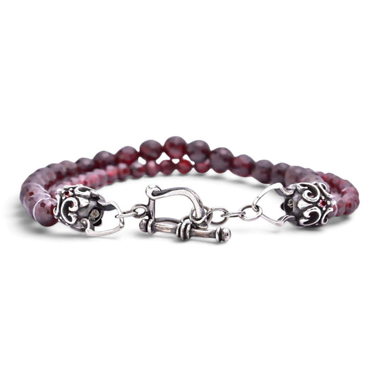 Truelements Jewelry men's bracelet featuring natural garnet beads, oxidized sterling silver parts, and red zirconia.