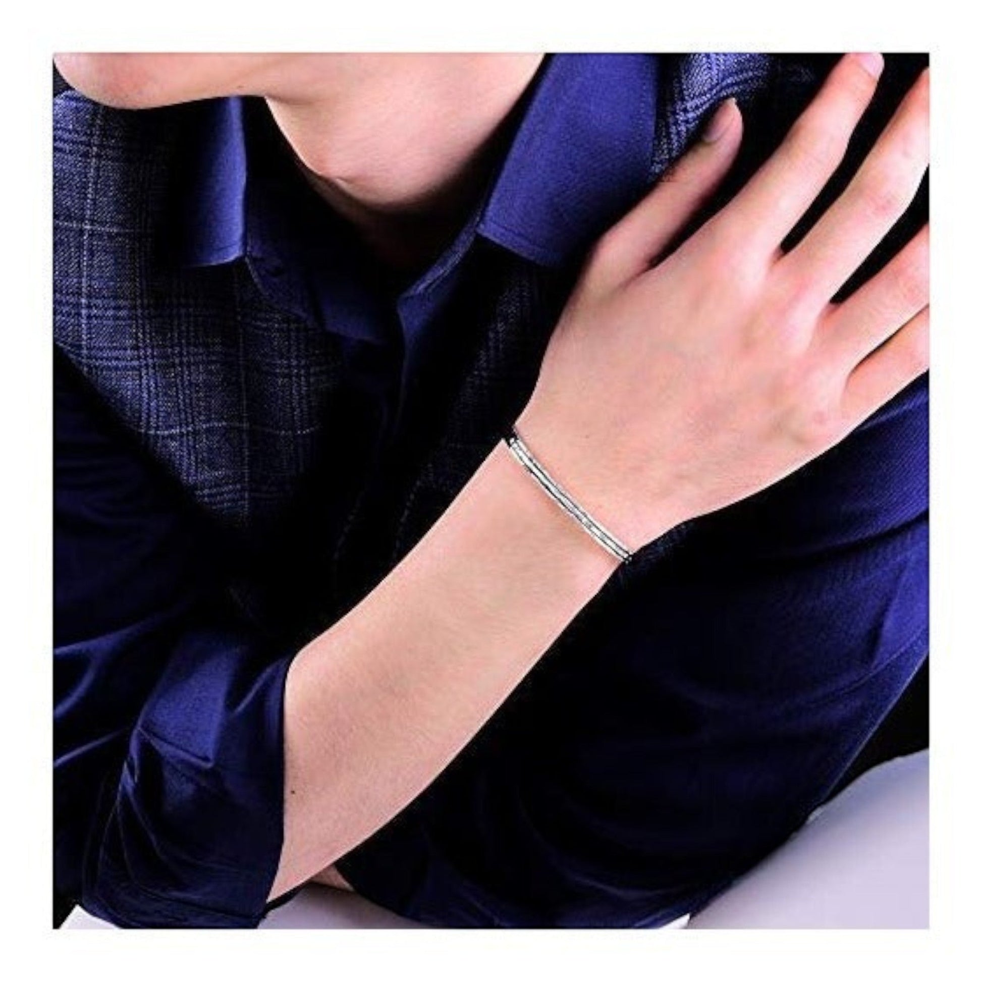 Truelements Jewelry men's sterling silver 925 bangle featuring a textured hammered finish worn on a wrist