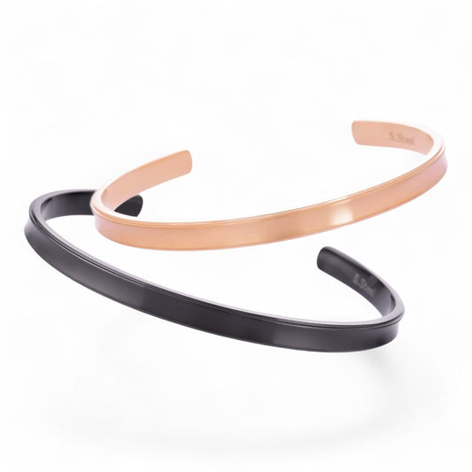 Truelements Jewelry pair of matte surgical stainless steel bangles in black and pink gold for couples