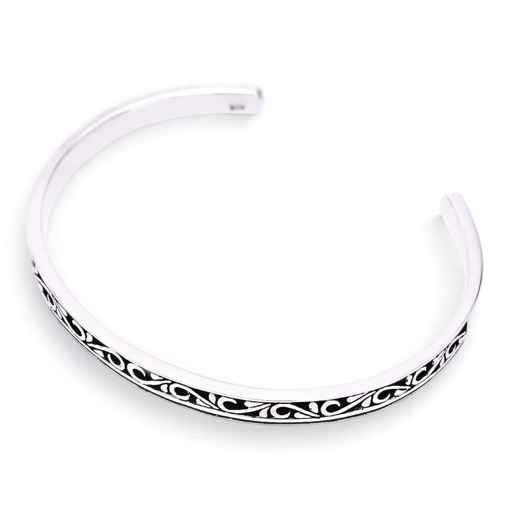 Truelements Jewelry sterling silver men's bangle featuring intricate arabesque openwork with a dark oxidized finish.