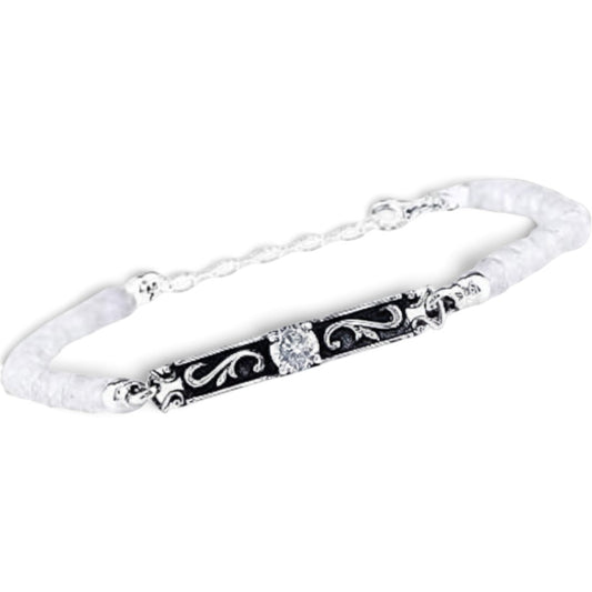 Truelements Jewelry sterling silver bracelet featuring an arabesque center piece with moonstone and clear zirconia.