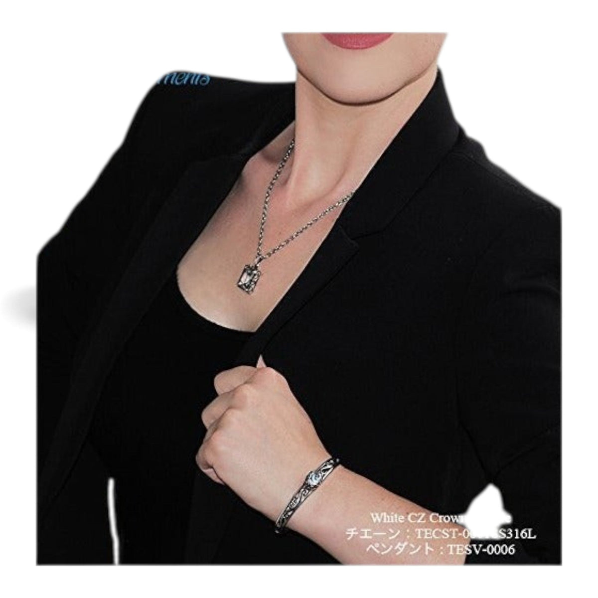 Truelements Jewelry sterling silver bangle with arabesque crown motif and clear zirconia worn by a model