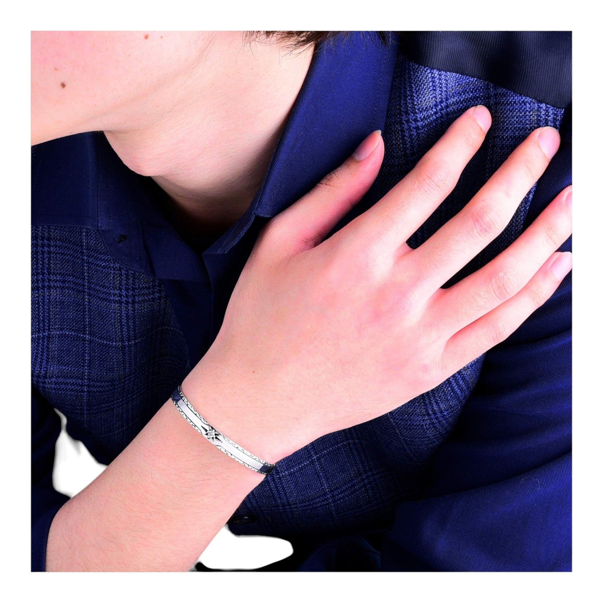 Truelements Jewelry sterling silver 925 cuff bracelet with sun motif and clear cubic zirconia on a man's wrist