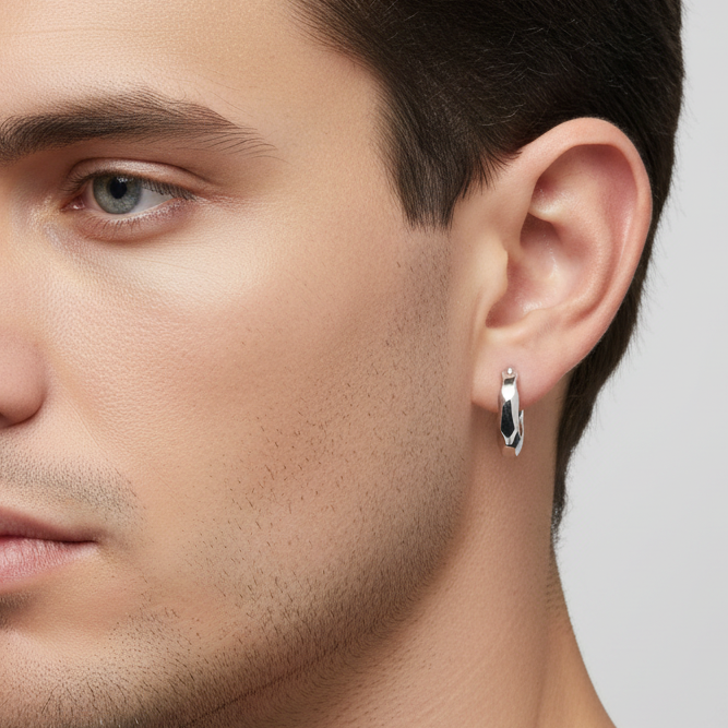 Truelements Jewelry silver 925 hoop earring with multi-faceted design worn by a man, featuring a polished finish.