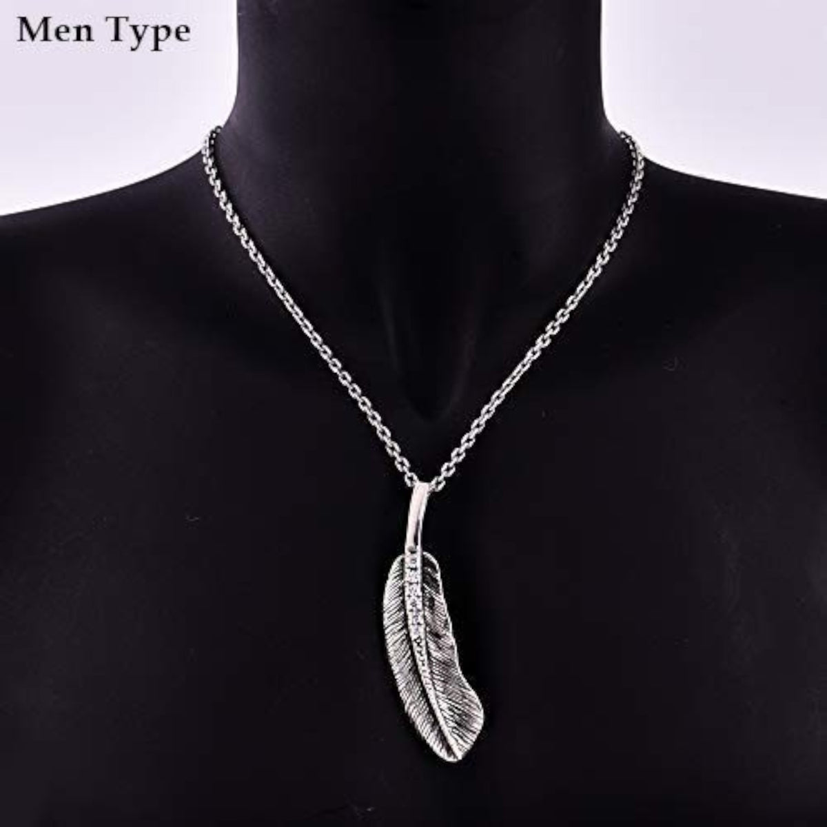 Truelements Jewelry silver 925 feather pendant necklace with clear cubic zirconia and oxidized finish on a mannequin