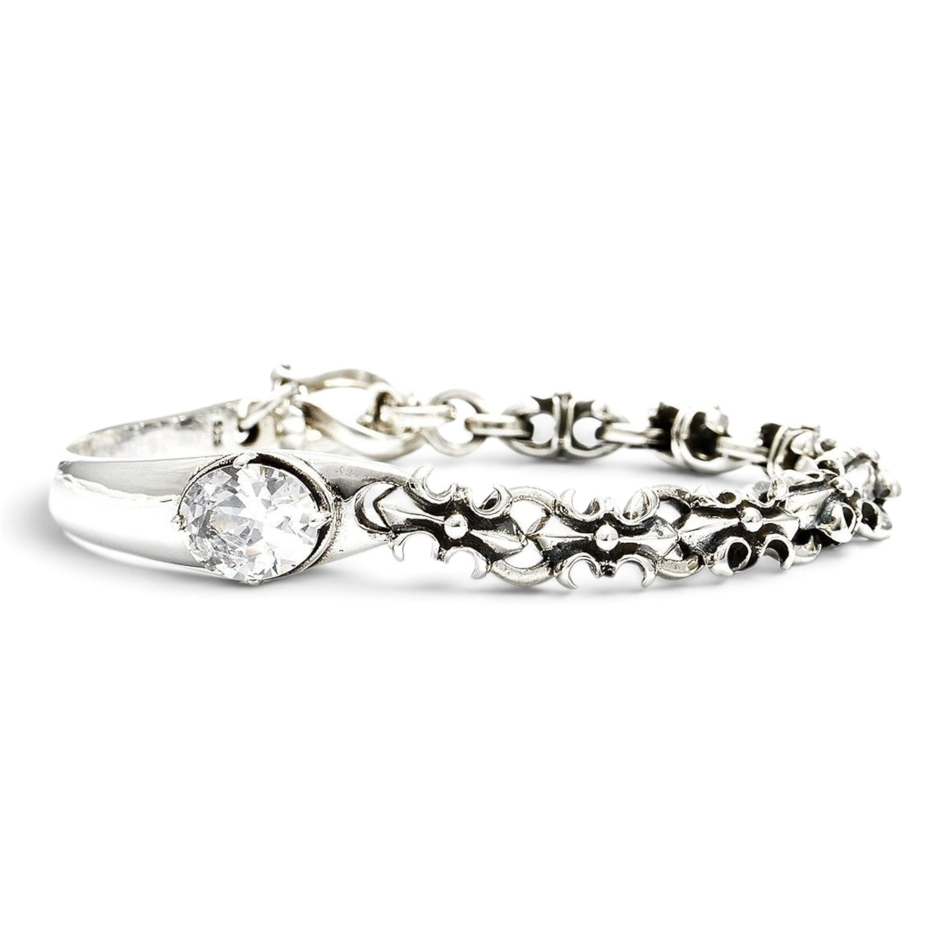 Truelements Jewelry sterling silver unisex bangle with fleur-de-lis motif, oxidized finish, and clear cubic zirconia.