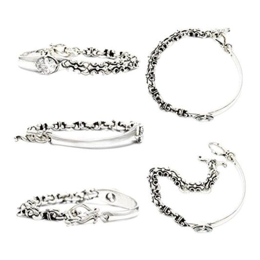 Truelements Jewelry sterling silver bangle featuring a fleur-de-lis motif, clear cubic zirconia, and oxidized finish.