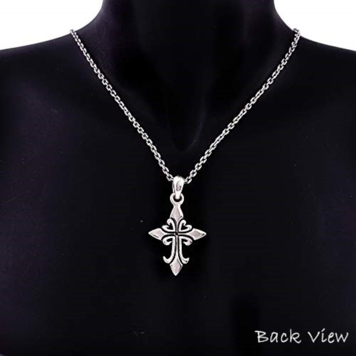Truelements Jewelry silver 925 fleur-de-lis cross pendant with black zirconia on a chain worn on a black mannequin