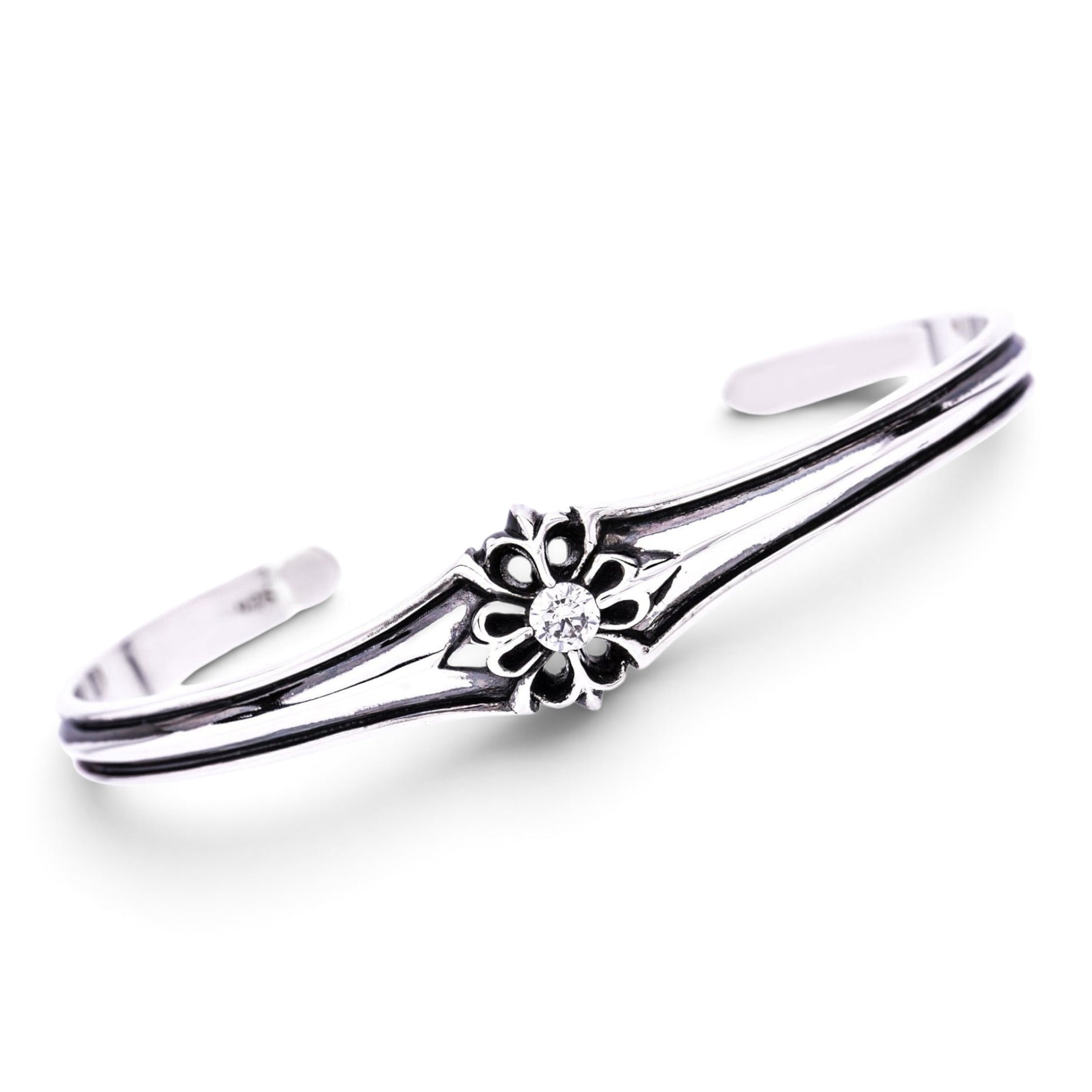 Truelements Jewelry sterling silver 925 men's bangle featuring a floral cross motif with a clear cubic zirconia stone.