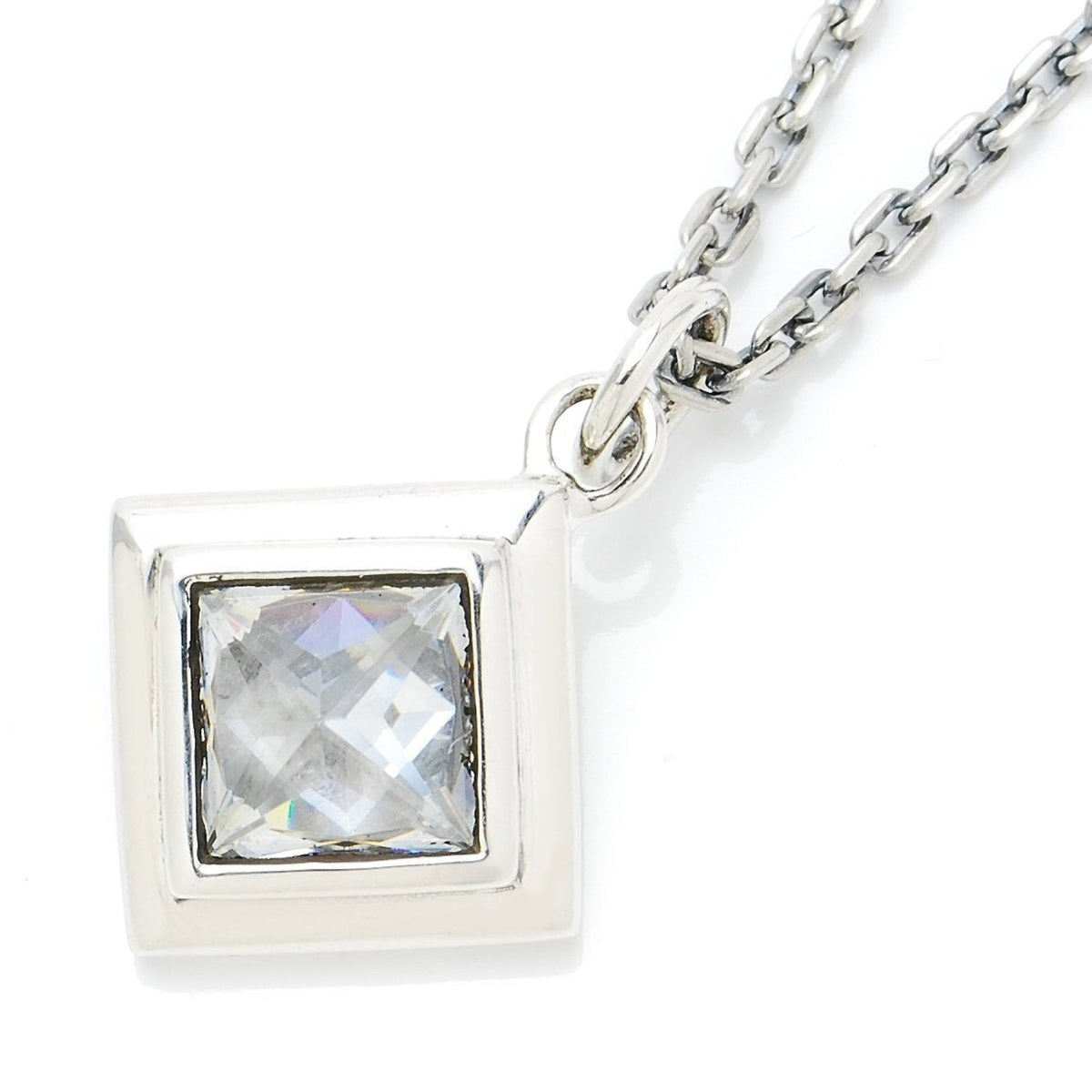 Truelements Jewelry silver 925 pendant featuring a square pyramid-cut clear cubic zirconia in a geometric frame