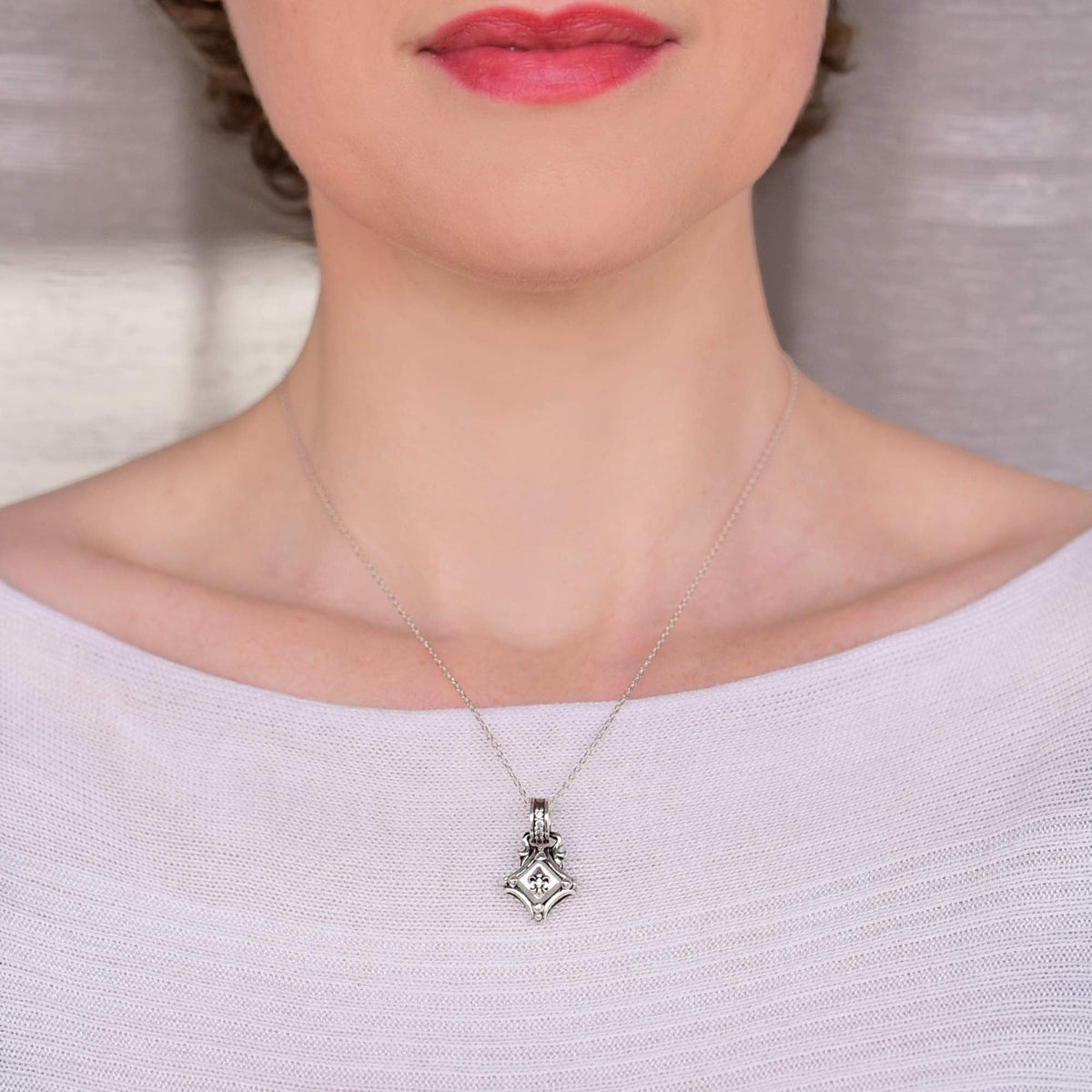 Truelements Jewelry sterling silver square pendant with white shell and clear zirconia on a delicate chain