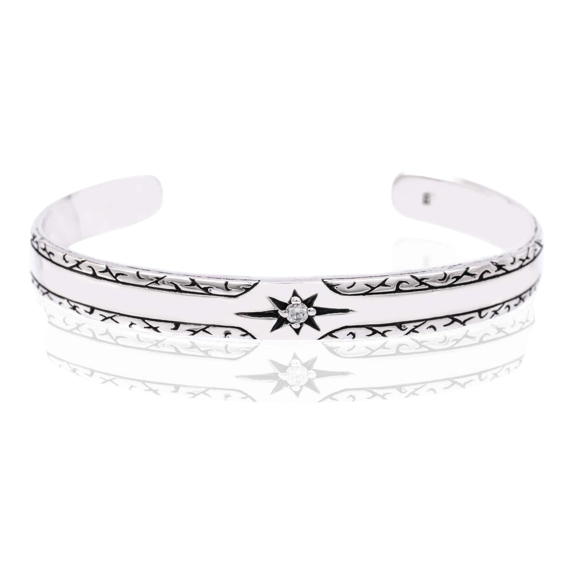 Truelements Jewelry sterling silver 925 men's bangle featuring a sun motif with a clear cubic zirconia stone.