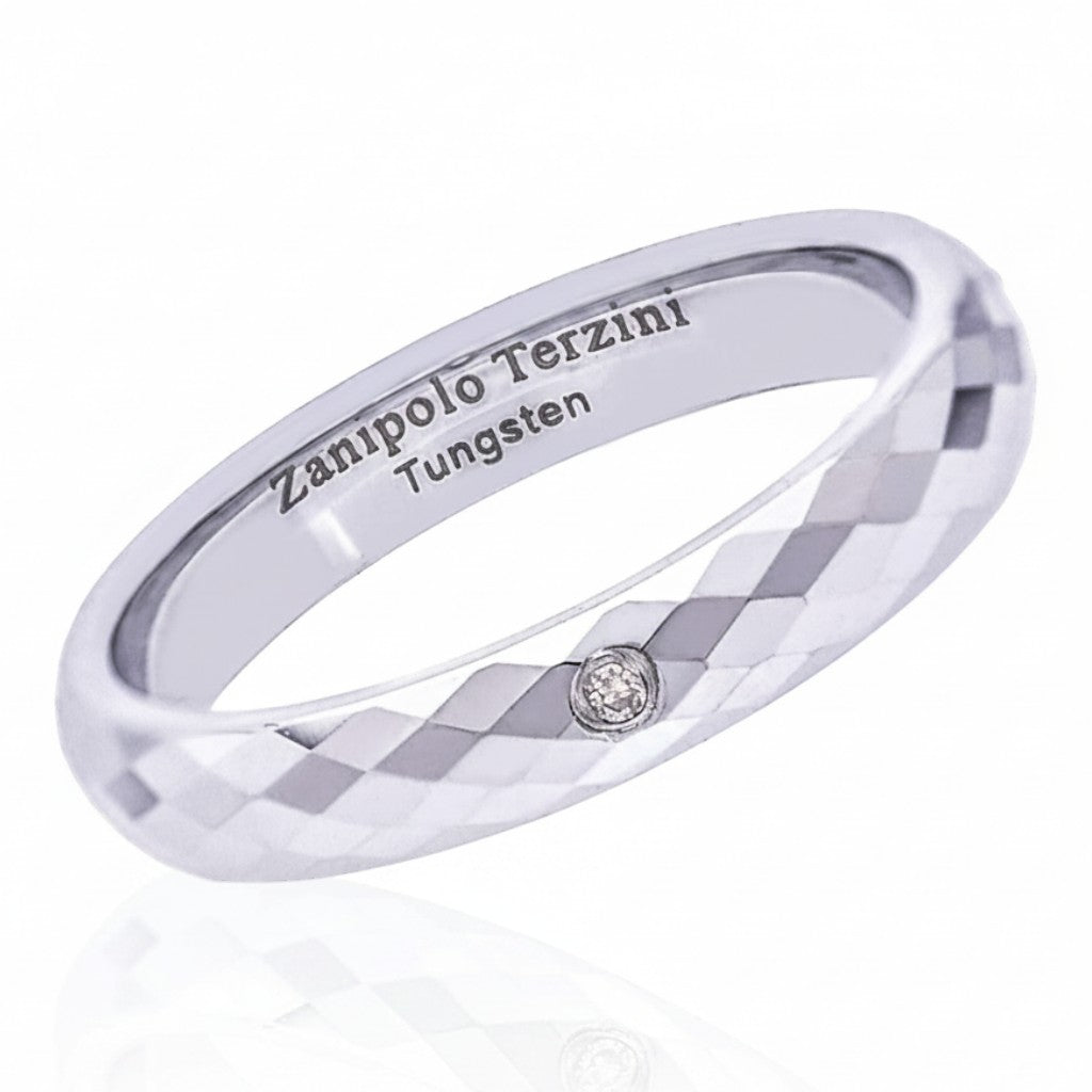 Truelements Jewelry silver tungsten pinky ring with mirror-cut facets and a single embedded clear diamond.