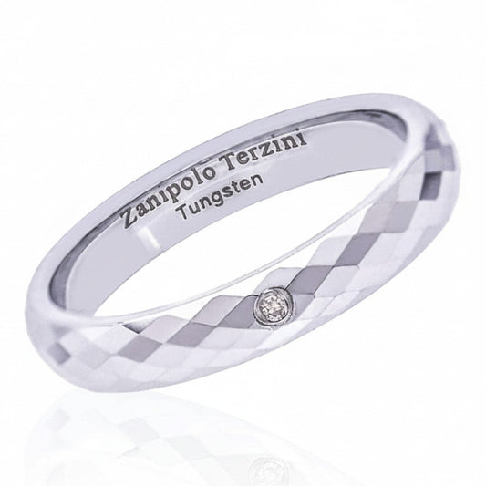 Truelements Jewelry silver tungsten pinky ring with mirror-cut facets and a single embedded clear diamond.