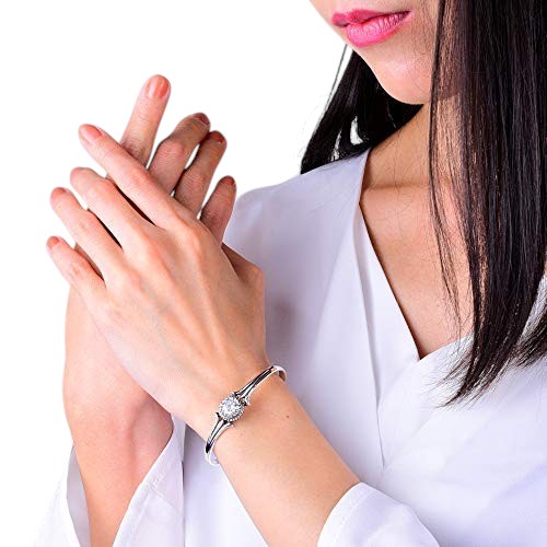 Truelements Jewelry unisex sterling silver bangle featuring a clear 8mm cubic zirconia stone on a model's wrist.