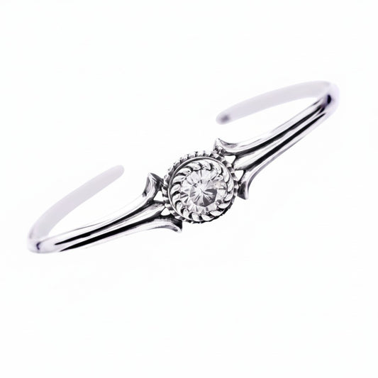 Truelements Jewelry unisex sterling silver bangle featuring an 8mm clear cubic zirconia stone with oxidized finish.
