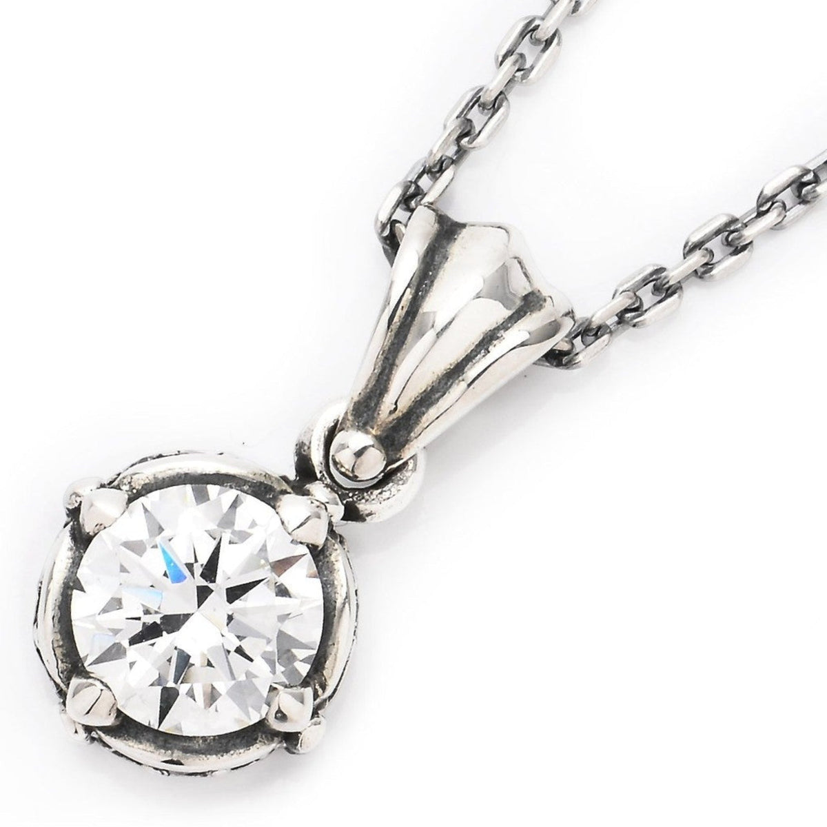 Truelements Jewelry sterling silver pendant featuring a round clear cubic zirconia in a crown-style setting