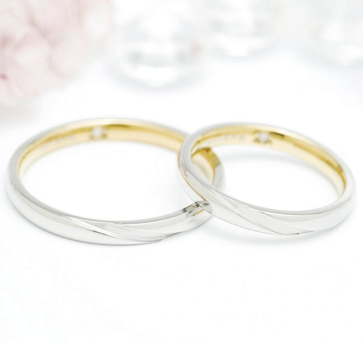 Truelements Jewelry surgical stainless steel ring with silver exterior, gold interior, and inner diamond setting.