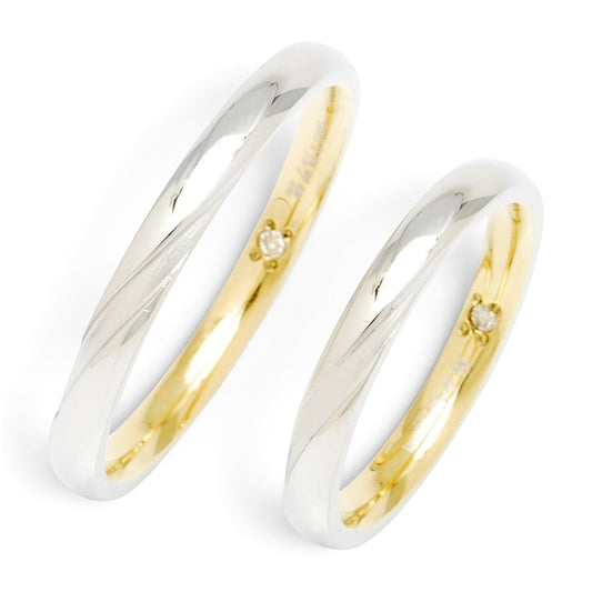 Truelements Jewelry surgical stainless steel ring with silver exterior, gold interior, and inner diamond accent.