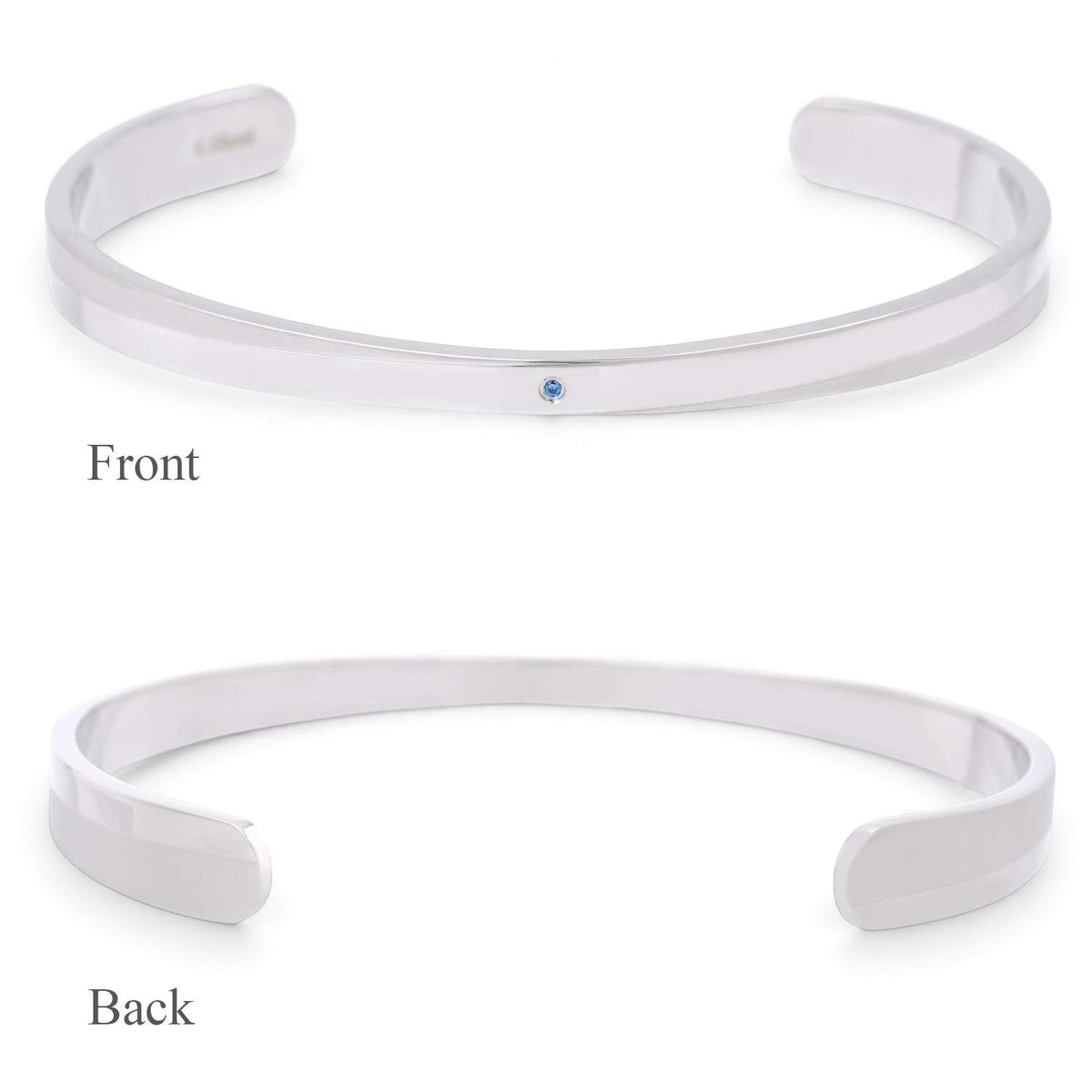 Truelements Jewelry men's 316L surgical stainless steel bangle featuring a small natural light blue sapphire.